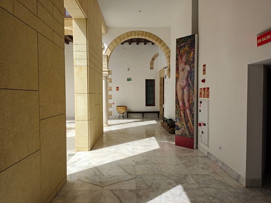 A bright interior view featuring historic architecture and art in El Puerto de Santa María