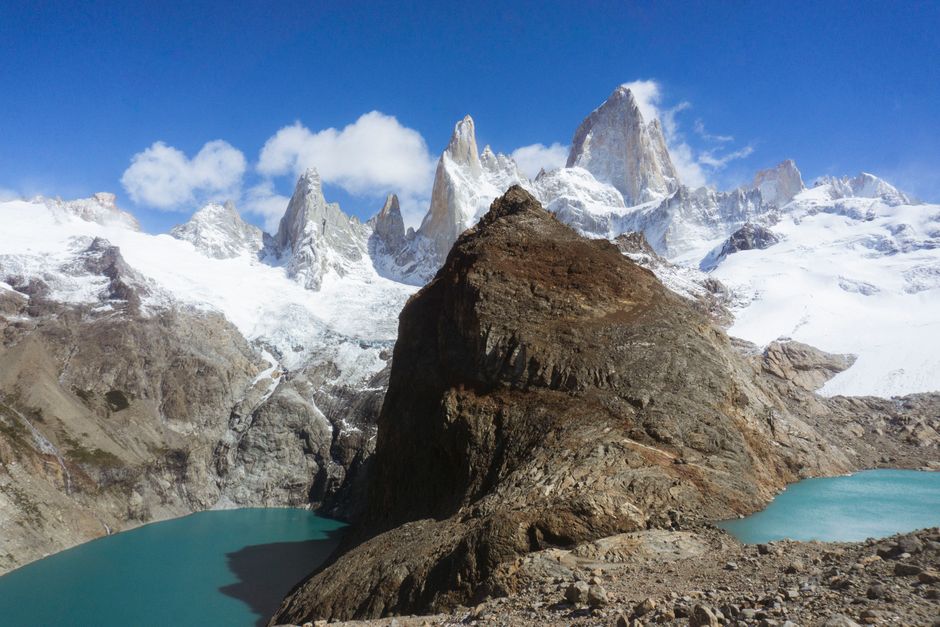 Breathtaking view of Fitz Roy mountain range with turquoise lakes in Patagonia's Los Glaciares National Park.