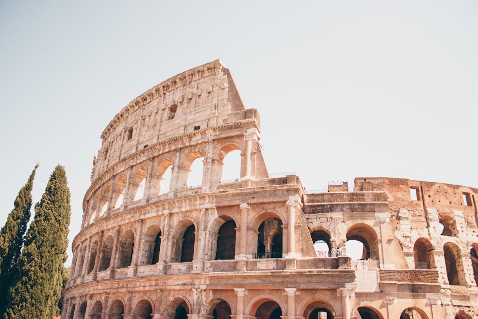 Experience the grandeur of the ancient Colosseum in Rome during a sunny day.