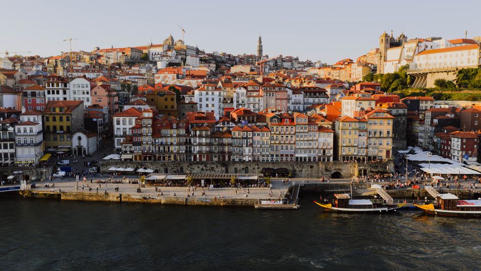Experience the vibrant architecture of Porto's Ribeira District from above at sunset.