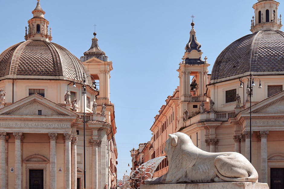 Dual churches and lion statue in Piazza del Popolo, Rome showcasing historic Italian architecture.